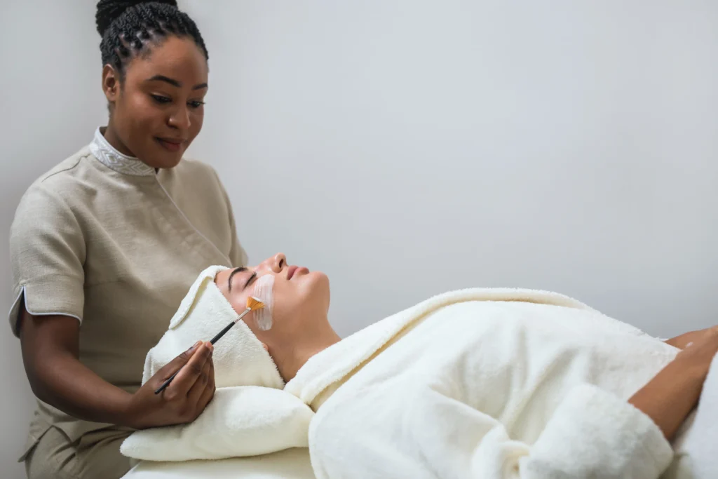 A lady is doing facial treatment at a resort near Doha.
